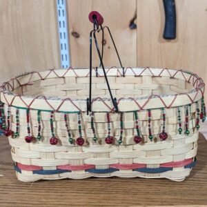 Hand woven basket with decorative elements