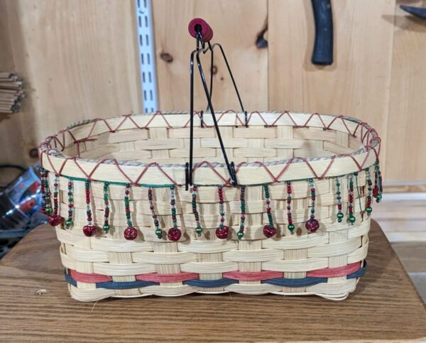 Hand woven basket with decorative elements